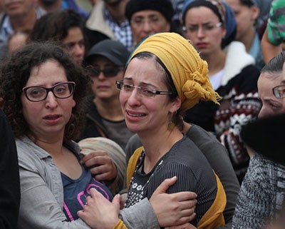 Two distraught ladies amongst the crowd afer a terror attack
