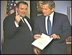 Mike Huckabee and George W. Bush