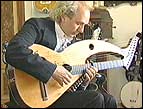 John Doan plays the harp guitar