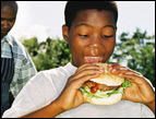 kid eating hamburger