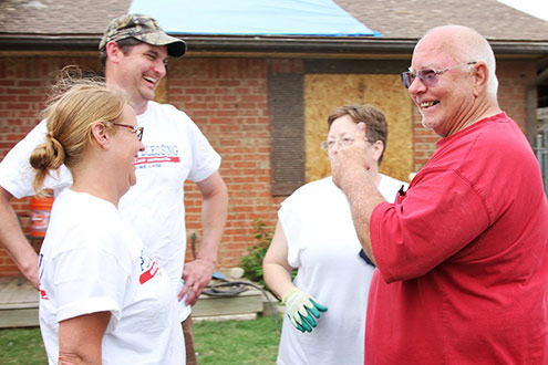 Steve and Wife laughing with Operation Blessing workers