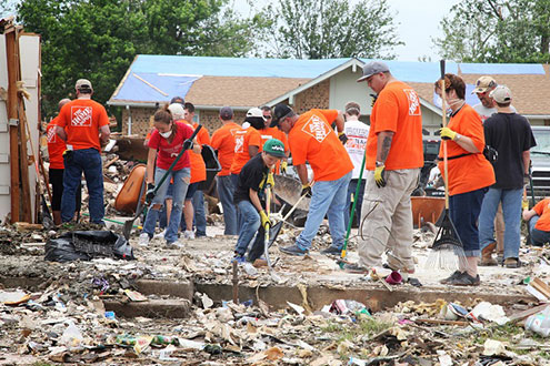 The Home Depot clean up volunteers clearing rubble.