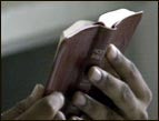 church history king james bible hands holding small red bible