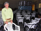 Bill Horan, OBI president, at the Operation Blessing warehouse in Haiti where the wheelchairs were assembled. 