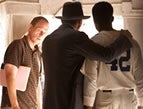 Director Brian Helgeland with actors on the set of 42