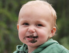 toddler eating mud