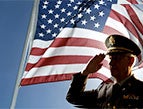 veterans day Devotion military man in uniform saluting american flag